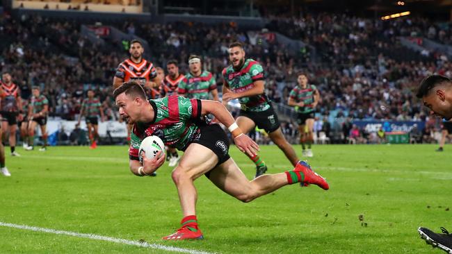 SYDNEY, AUSTRALIA - MAY 25: Damien Cook of the Rabbitohs scores a try during the round 11 NRL match between the South Sydney Rabbitohs and the Wests Tigers at ANZ Stadium on May 25, 2019 in Sydney, Australia. (Photo by Cameron Spencer/Getty Images)