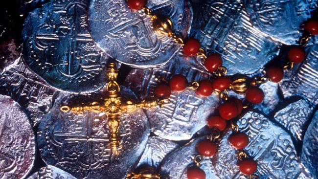 Silver coins and rosary beads salvaged from the wreck of the Spanish galleon Santa Margarita.