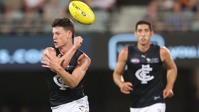 Sam Walsh of the Blues handballs during a match. (Photo by Chris Hyde/Getty Images)