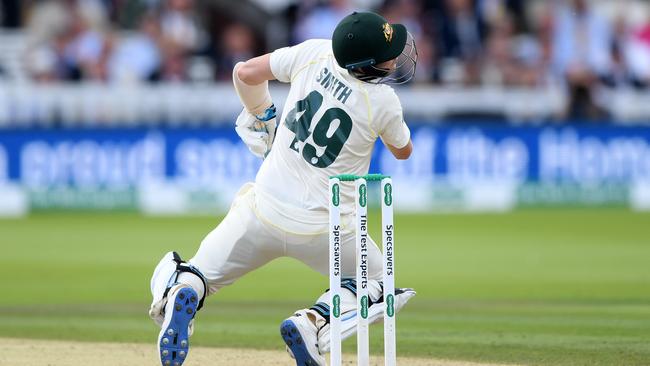 Steve Smith collapses to the pitch after he was hit on the neck by the Archer bouncer. Picture: Getty Images