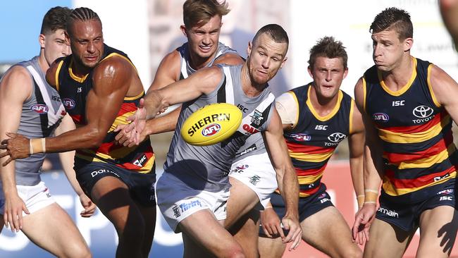 Robbie Gray pounces on a loose ball against the Crows. Picture: Sarah Reed