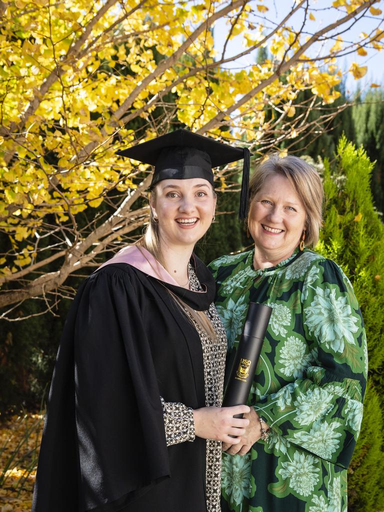 Bachelor of Education (Primary) graduate Courtney Sippel is congratulated by mum Debbie Walker at UniSQ graduation ceremony at Empire Theatres, Tuesday, June 27, 2023. Picture: Kevin Farmer