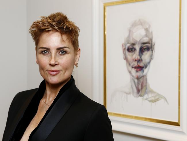 Dee Smart with her self portrait, <i>I'm Here,</i> which depicts herself while undergoing cancer treatment. Picture: John Appleyard