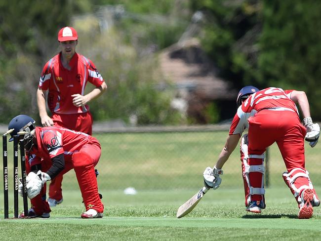 Devon Meadows batter Lucas Carroll makes his ground, just.