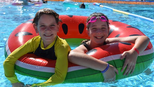 Brax Rabnott, 9, with sister Alexis Rabnott, 10, enjoying one of the Mackay region’s pools during a recent Inflatable Family Fun Day. Picture: Heidi Petith