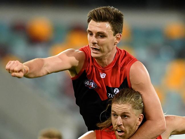 Jake Lever of the Demons (top) and Aaron Young of the Suns compete for the ball during the Round 8 AFL match between the Gold Coast Suns and the Melbourne Demons at the Gabba in Brisbane, Saturday, May 12, 2018. (AAP Image/Dan Peled) NO ARCHIVING, EDITORIAL USE ONLY