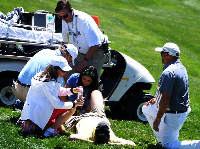 OAKMONT, PA - JUNE 14: Christopher Crawfords' caddie gets medical attention after injuring himself during a practice round prior to the U.S. Open at Oakmont Country Club on June 14, 2016 in Oakmont, Pennsylvania. Ross Kinnaird/Getty Images/AFP == FOR NEWSPAPERS, INTERNET, TELCOS & TELEVISION USE ONLY ==