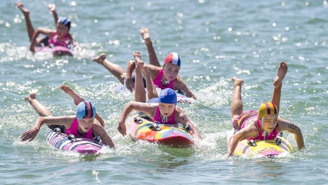 Competitors in action during an under-11 Female Board quarter-final at the NSW Surf Life Saving Championships at Blacksmiths Beach on Friday, 28 February, 2020. Picture: Troy Snook