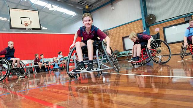 ALL IN: Aaron Saggus from Coffs Harbour Public School has a go at wheelchair sport at Sportz Central stadium. Picture: TREVOR VEALE