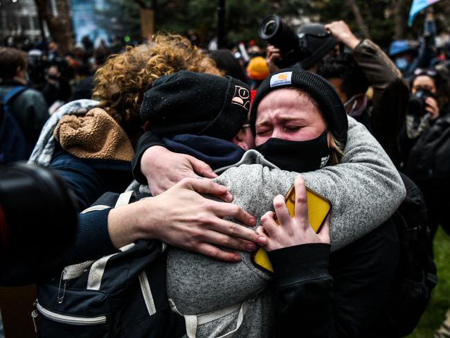 People embrace each other as the verdict is announced in the trial of former police officer Derek Chauvin outside court. Picture: AFP