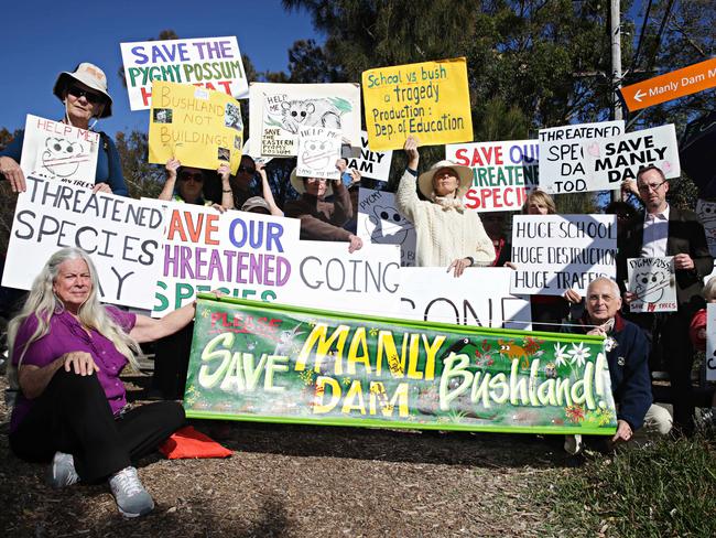 Manly Dam Catchment Committee protesting out the front of Manly Vale Public School about the controversial redevelopment of the school on bushland. Picture: Adam Yip.