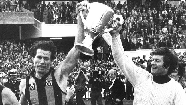 Don Scott (left) and David Parkin hold the 1978 premiership cup aloft. Picture: HWT