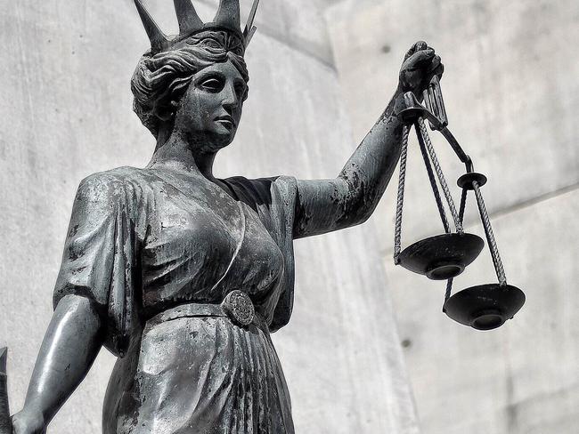 A statue of Themis, the Greek God of Justice  stands outside the Supreme Court in Brisbane, Thursday, Oct. 20, 2016. (AAP Image/Dave Hunt) NO ARCHIVING