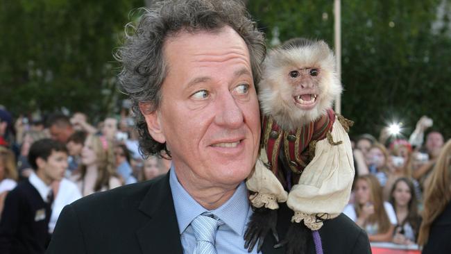 Monkey business ... Geoffrey Rush with Jack the Monkey at Disneyland in Anaheim, California. Picture: Disney Pictures.