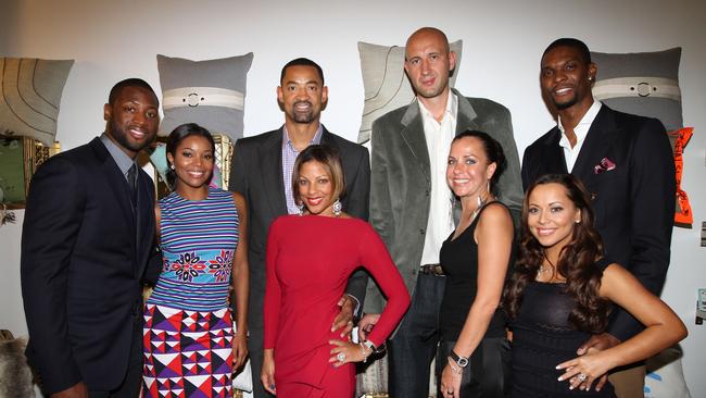 MIAMI, FL - DECEMBER 03: Dwyane Wade, Gabrielle Union, Juwan Howard, Janine Howard, Zydrunas Ilgauskas, Jennifer Ilgauskas, Chris Bosh and Adrienne Bosh attend "Unlock" Art of Basketball Event during Graffiti Gone Global on December 3, 2011, 2011 in Miami, Florida. (Photo by Alexander Tamargo/Getty Images for Premiere Beverage)