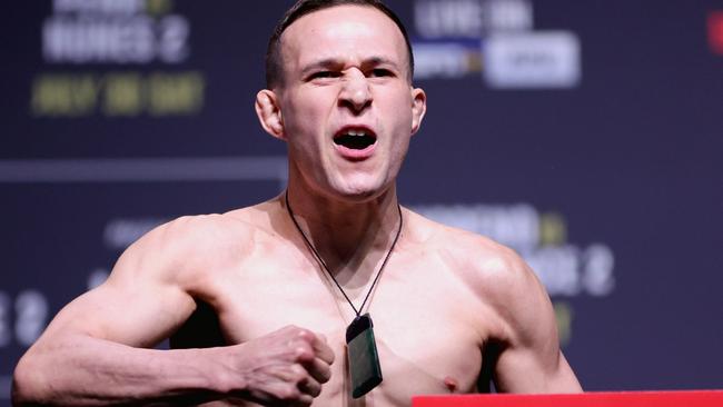 DALLAS, TEXAS - JULY 29: Kai Kara-France of New Zealand poses on the scale during the UFC 277 ceremonial weigh-in at American Airlines Center on July 29, 2022 in Dallas, Texas. (Photo by Carmen Mandato/Getty Images)