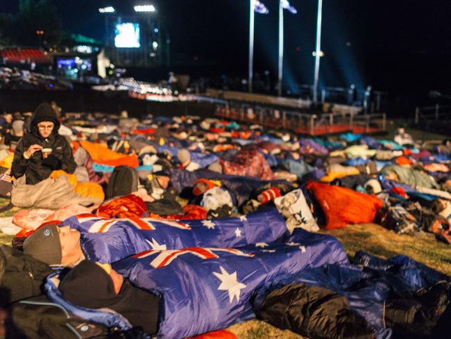 People sleep at Anzac Cove prior to the dawn service. Picture: Bradley Secker