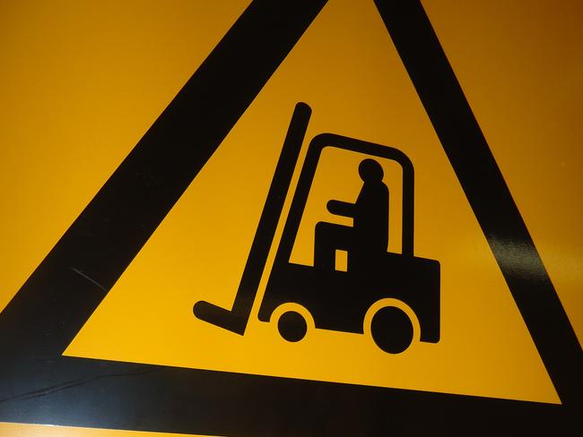 Generic photo of a sign that says: Watch Out Forkliftting Operating Area. Construction/signs/forklift.