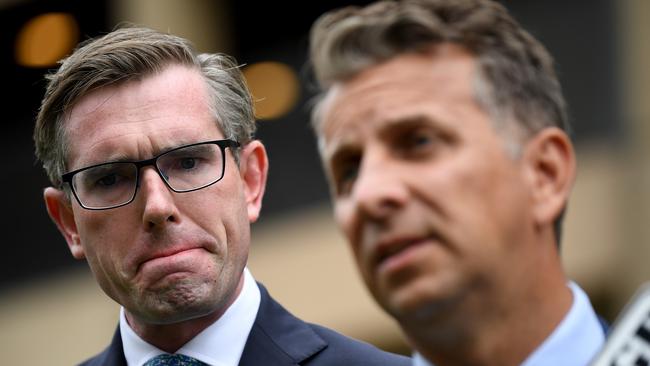 NSW Treasurer Dominic Perrottet, left, and NSW Minister for Transport and Roads Andrew Constance speak outside Parliament House in Sydney. Picture: AAP