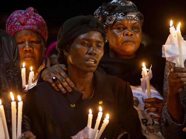 Akon Guode, centre, at a vigil after the lake incident. Picture: Ian Currie