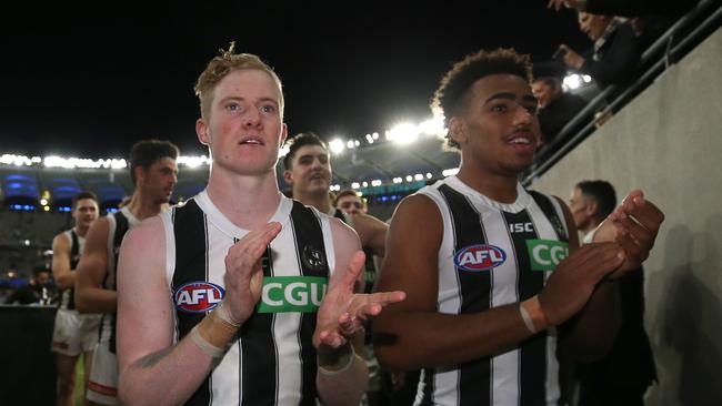 Former West Adelaide star John Noble with fellow debutant Isaac Quaynor after Collingwood’s one-point win over West Coast in Perth on Friday night. Picture: Paul Kane/Getty Images