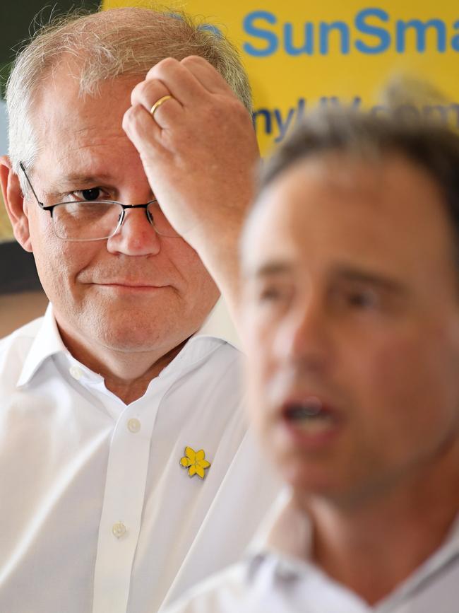 Scott Morrison watches then-health minister Greg Hunt speak at a press conference last year. Picture: NCA NewsWire / Dan Peled