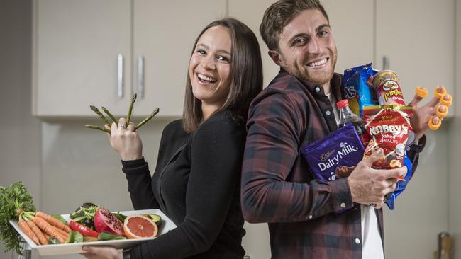 Olivia Rugg, 23 and Dylan Weickhardt, 24, combine healthy eating with snacks. Picture: Jason Edwards