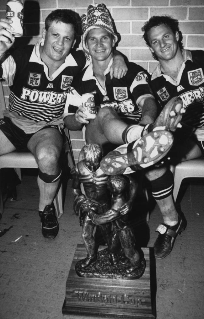 The Broncos’ Ipswich connection includes Allan Langer (centre) and brothers Kevin (left) and Kerrod Walters, seen here celebrating the club’s first grand final win, over the Dragons in 1992.