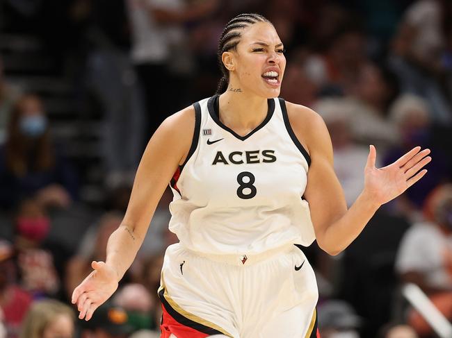 PHOENIX, ARIZONA - OCTOBER 06: Liz Cambage #8 of the Las Vegas Aces celebrates after a three-point shot against the Phoenix Mercury during the second half in Game Four of the 2021 WNBA semifinals at Footprint Center on October 06, 2021 in Phoenix, Arizona. The Aces defeated the Mercury 93-76.  NOTE TO USER: User expressly acknowledges and agrees that, by downloading and or using this photograph, User is consenting to the terms and conditions of the Getty Images License Agreement. (Photo by Christian Petersen/Getty Images)