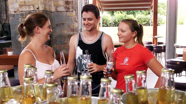 Natasha Shaw, Andrew and Carolyn Sydenham drink buckets of Corona at the Substation Bar at the Breakfast Creek in February, 2004. Picture: Andrew Maccoll