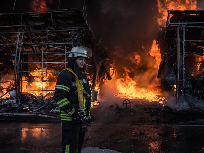 Firefighters try to extinguish a fire at the Saltivka construction market, hit by 6 rounds of Russian heavy artillery in Kharkiv. Picture: Getty Images