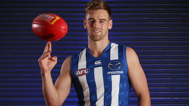 North Melbourne recruit Dom Tyson in his new kit at Arden St. Picture: Michael Klein