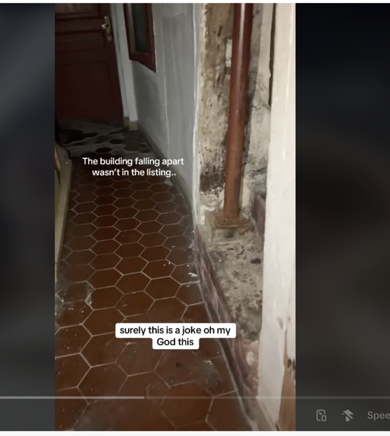 The TikTok video shows the hallway dimly lit with sections of the walls missing. Picture: Supplied.