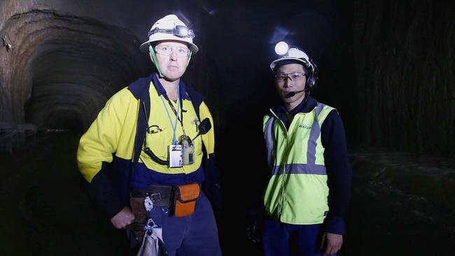 Land Down Under: Daryl Gilchrist and Charles Leung inside the Northside Storage Tunnel. Picture: Tim Hunter