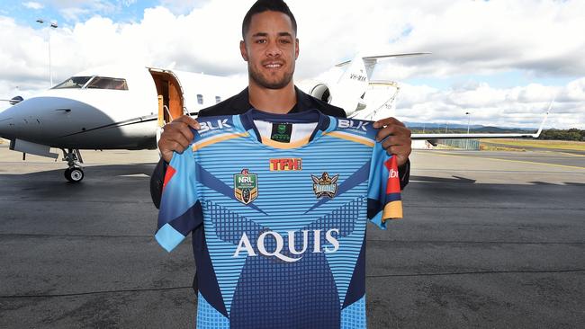 Jarryd Hayne poses with a Titans jersey.