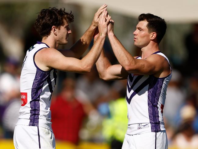 ALICE SPRINGS, AUSTRALIA - JUNE 02: Sam Sturt (left) and Jaeger O'Meara of the Dockers celebrate during the 2024 AFL Round 12 match between the Melbourne Demons and the Fremantle Dockers at TIO Traeger Park on June 02, 2024 in Alice Springs, Australia. (Photo by Michael Willson/AFL Photos via Getty Images)