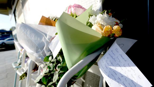 Flowers left as a memorial at the site where Liz Albornoz died after a car ploughed into a cafe she was dining at in North Epping. Picture: Jeremy Piper