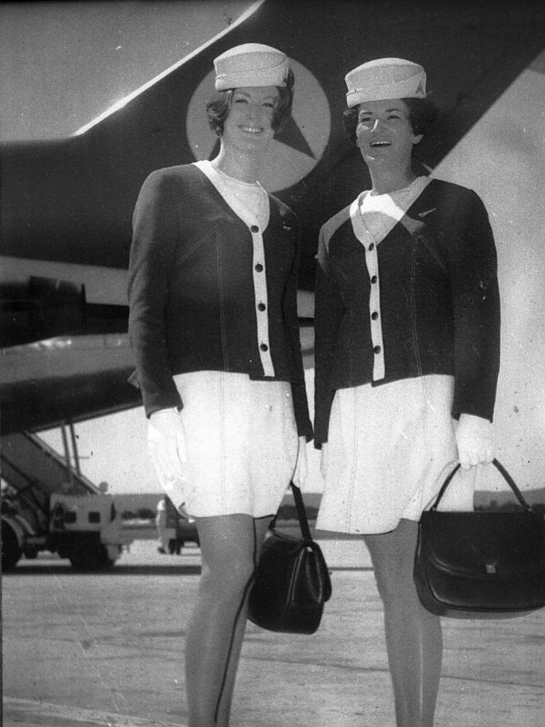 Leigh St Luggage shop proprietor Julie Barnes (l) as a flight attendant at Adelaide Airport in 1972. 1970s air hostess uniform