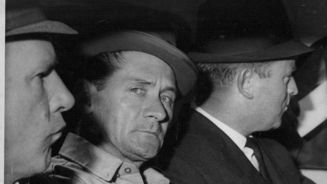 Ronald Ryan (centre) being extradited from Sydney to Melbourne in 1966 for shooting and killing a warder when he escaped from Pentridge.