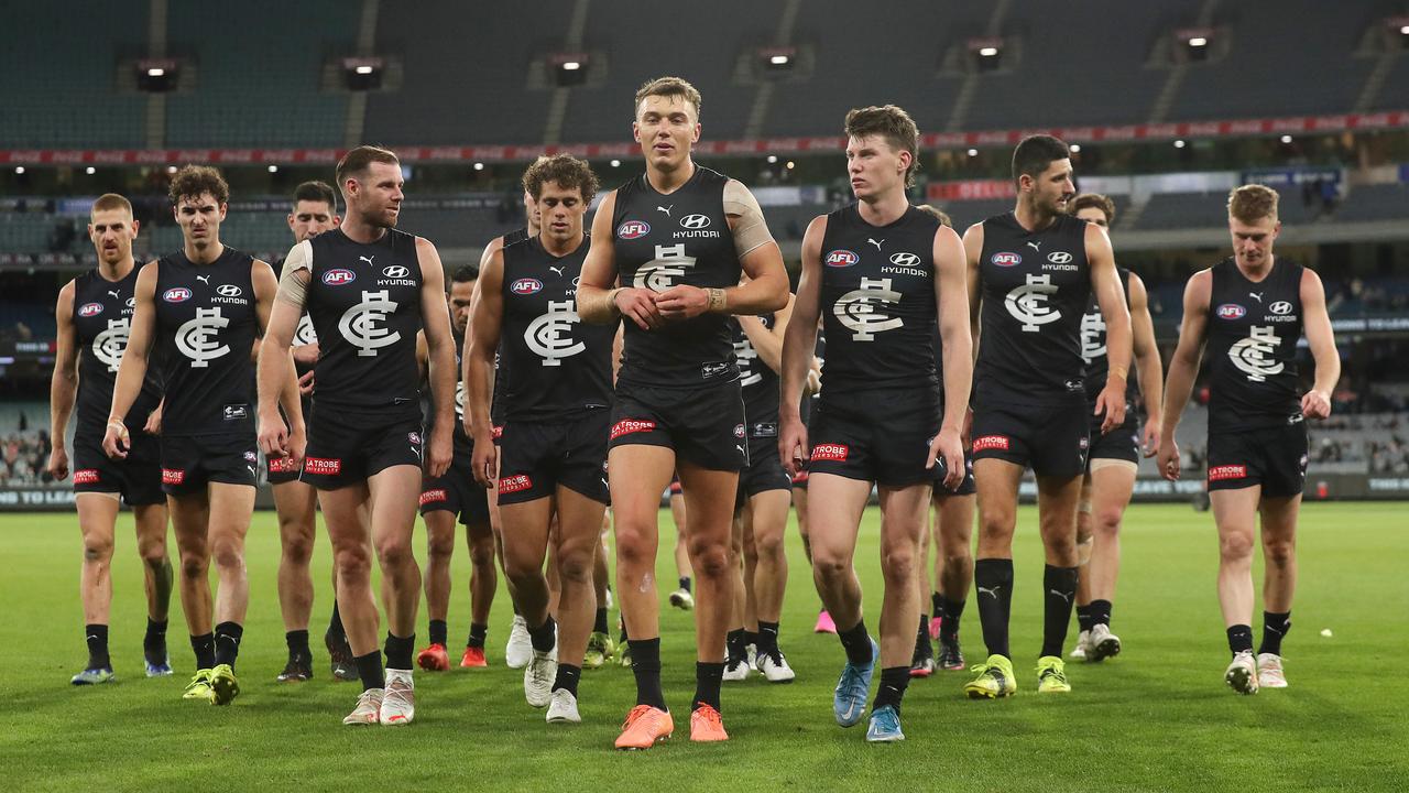 Carlton’s players walk off the MCG after losing to Port Adelaide.