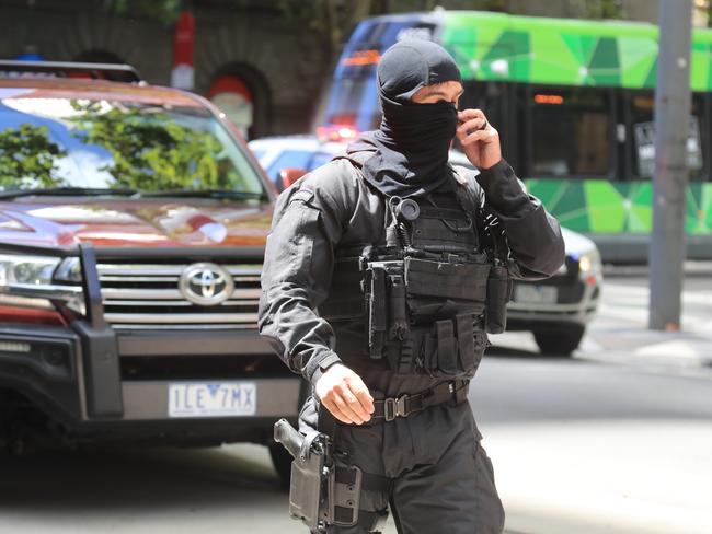 A heavily armed officer in the CBD. Picture: Alex Coppel