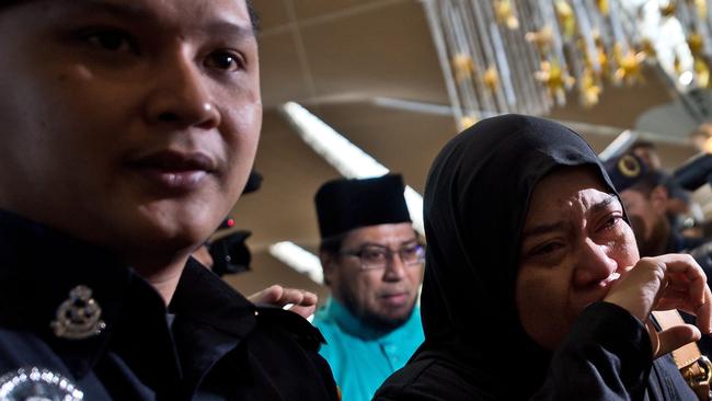 Relatives of passengers on-board Malaysia Airlines flight MH17 arrive at Kuala Lumpur International Airport. Picture: Afp