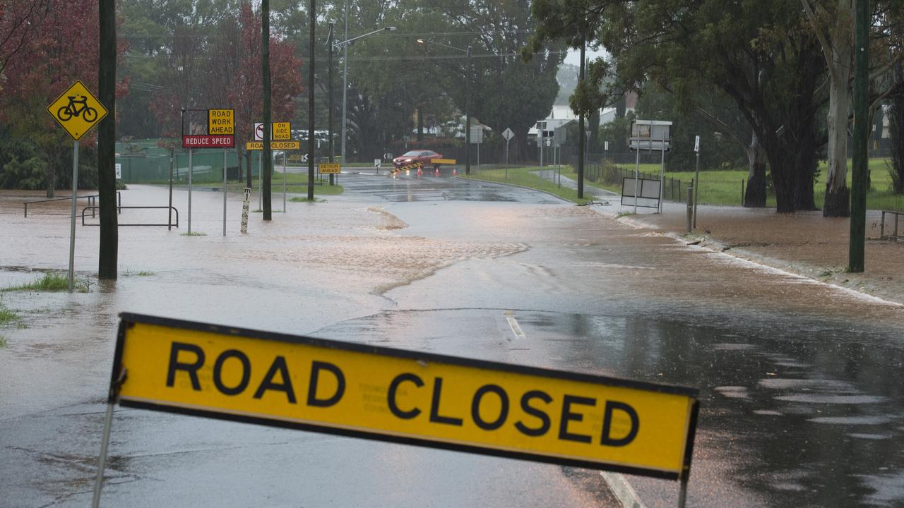 Water over the road closes Mackenzie St near South St as more than 80mm of rain has fallen on Toowoomba, Friday, May 01, 2015. Photo Kevin Farmer / The Chronicle