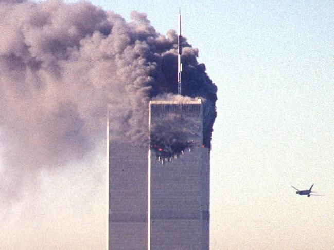 (FILES) This file photo taken on September 11, 2001 shows a hijacked commercial plane approaching the World Trade Center shortly before crashing into the landmark skyscraper in New York.   The Twin Towers collapsed later on that day. September 11, 2016 marks the fifteenth anniversary of the event. / AFP PHOTO / SETH MCALLISTER