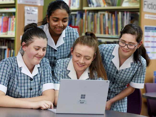 PENRITH PRESS/AAP. (L-R) Mongrove College students Abbie Shene, Malini Perera, Hannah Wilkinson and Jini-Mary McDonald pose for photographs in Orchard Hills on Thursday 5 December, 2019. Montgrove college has been revealed as one of the highest performing schools in NAPLAN in western Sydney. (AAP IMAGE / Angelo Velardo)