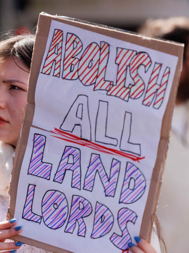 Demonstrators brandished signs outlining their demands. Picture: NCA NewsWire / David Swift