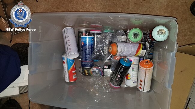 police seized a number items including spray paint cans. Picture: supplied