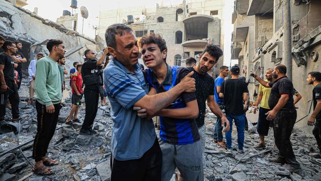 Palestinian civil defence members and others search for survivors after an Israeli bombardment in Khan Yunis on the southern Gaza Strip on October 19, 2023. Picture: Mahmud Hams/AFP