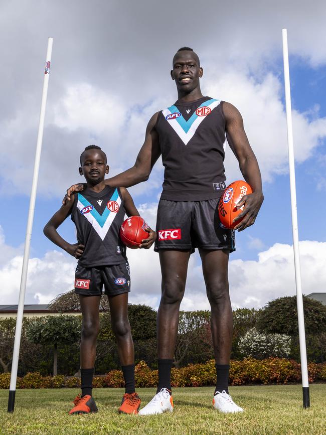 Aliir Aliir and Tim, showing the long and the short of it. Picture: Aaron Francis