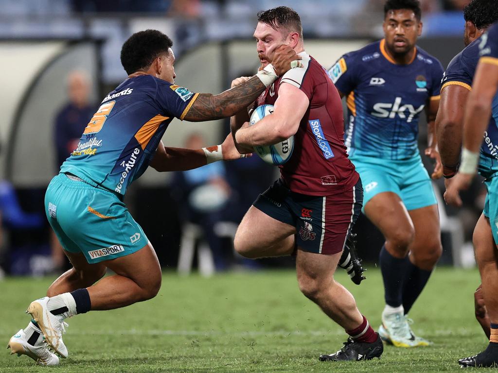 Queensland’s Matt Faessler runs into traffic during the clash with Moana Pasifika at Semenoff Stadium. Picture: Getty Images